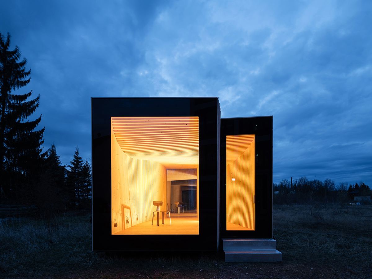 IBA Timber Prototype House: Front view of the prototype house at night