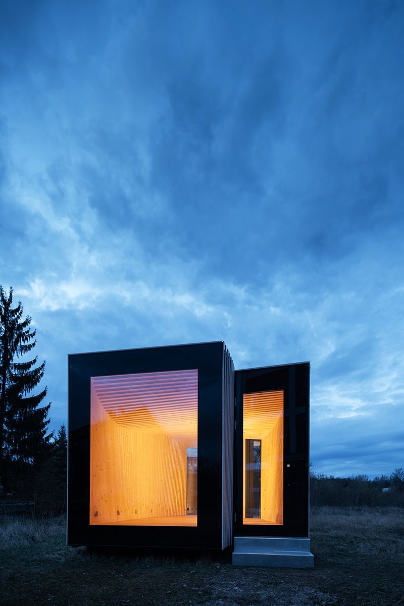 IBA Timber Prototype House: Narrow side of the prototype house at dusk