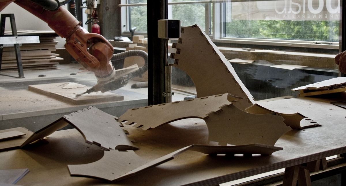Robotically Manufactured Material Systems: Robot processing a plywood part