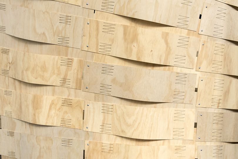 Robotic Sewing of Elastically Bent Plywood: Sewn plywood strips forming a curved wall