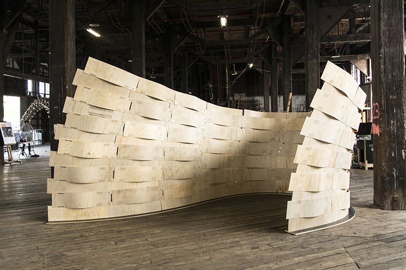 Robotic Sewing of Elastically Bent Plywood: Sewn plywood structure in a hall