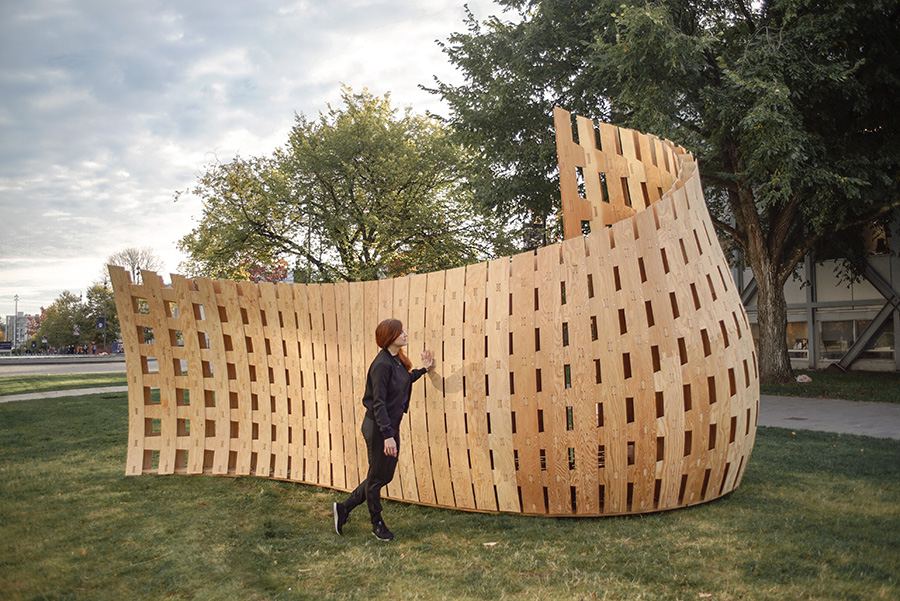 Wander Wood Pavilion: Visitor walking beside the pavilion